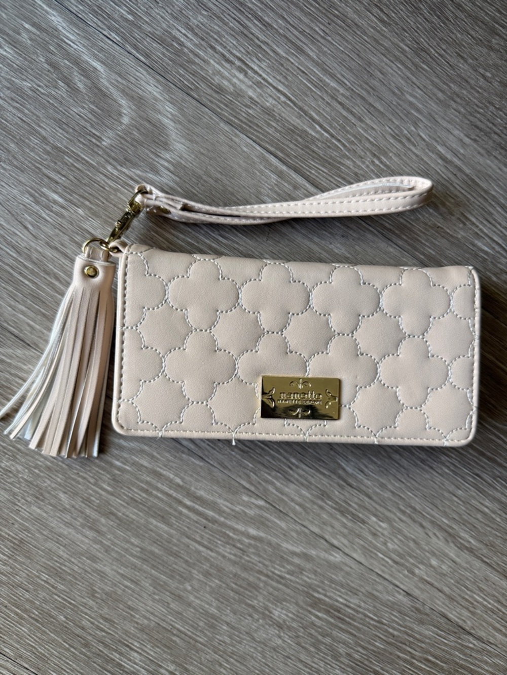 Nanette Lepore Cream Quilted Tassel Wristlet